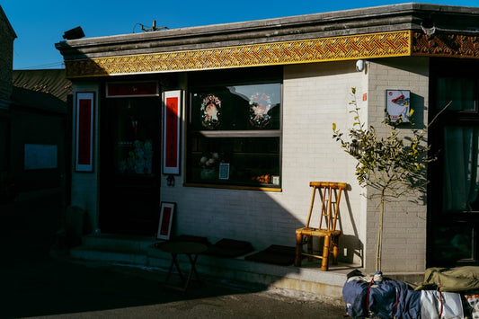 A small building with clothes outside of it