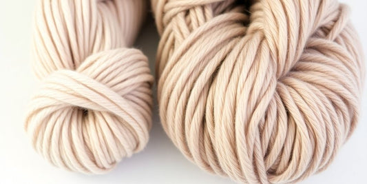 Two yarn skeins: one DK, one worsted weight.