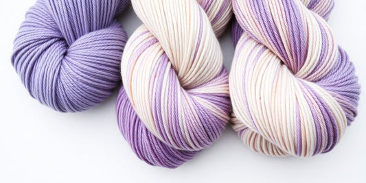 Yarn skeins: tonal, speckled, variegated colors.
