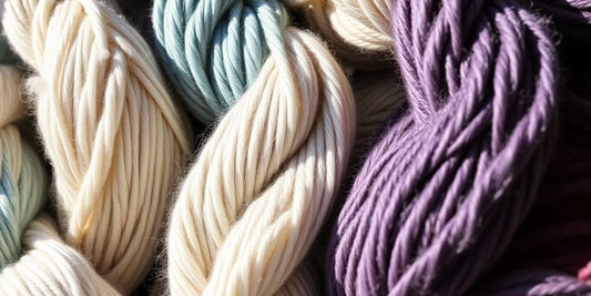Close-up, various richly-colored yarn skeins.