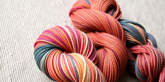 Two skeins hand-dyed yarn, one light, one dark.