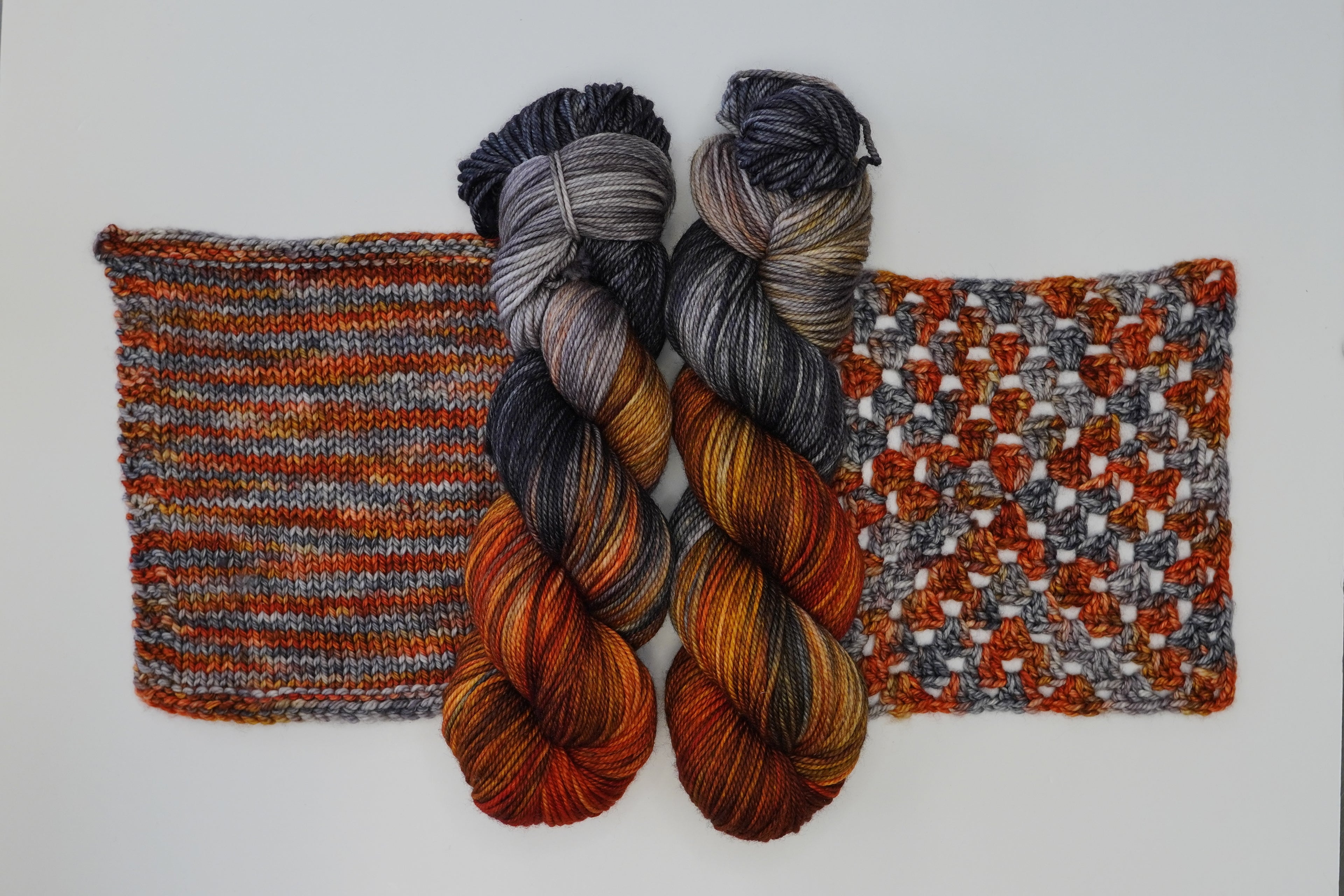 Wild Woollys Cobalt Rust yarn with knitted and crocheted swatches
