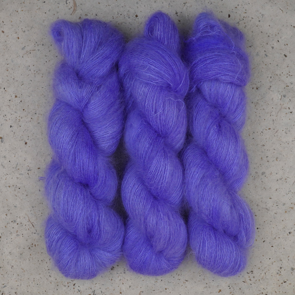 Wild Woollys Crocus Pocus Mohair+Silk yarn, three haloed skeins in soft periwinkle purple