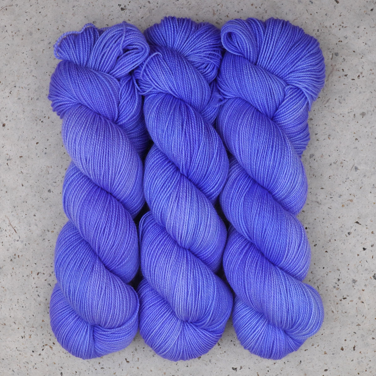 Wild Woollys Crocus Pocus Fingering yarn, three skeins in periwinkle and violet purple