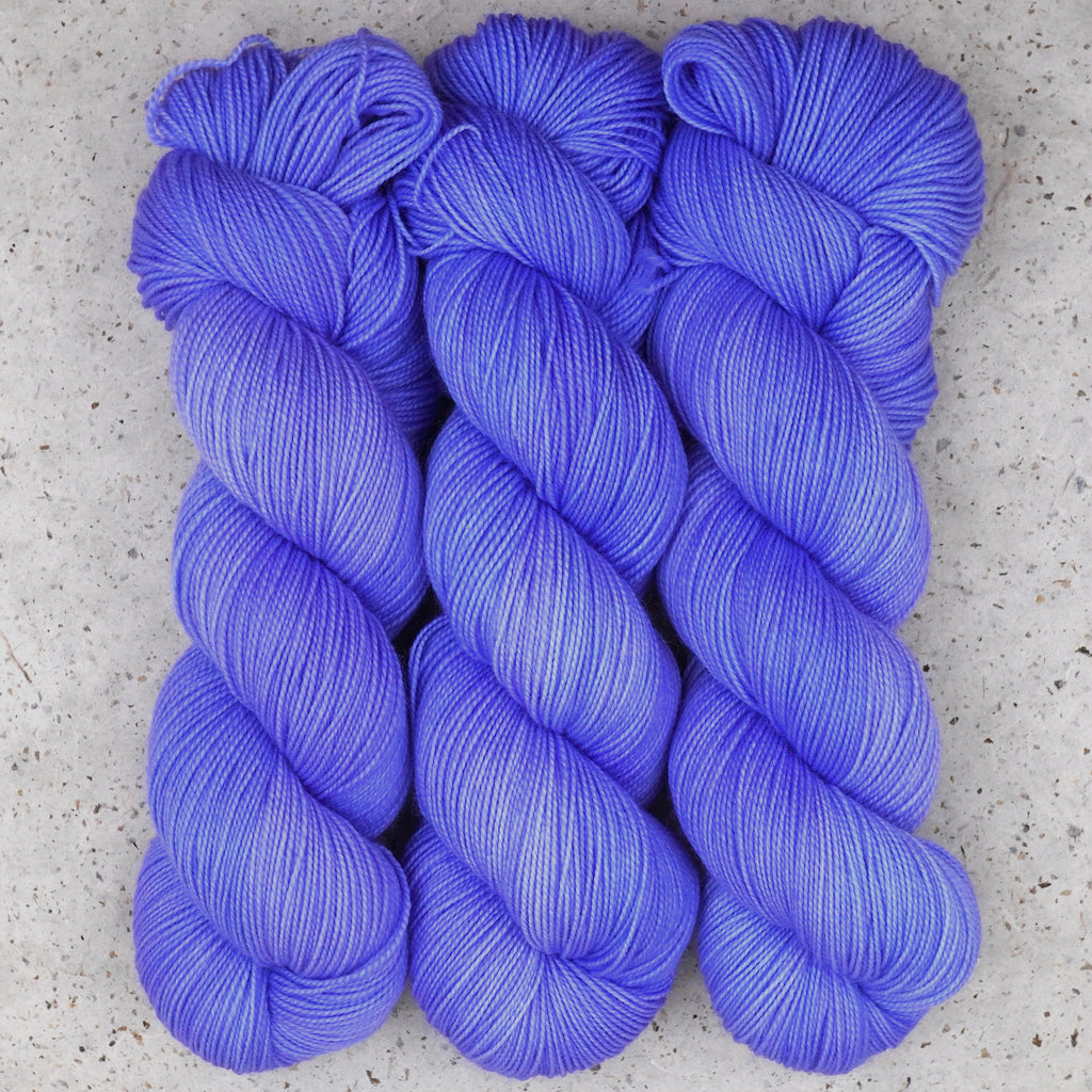 Wild Woollys Crocus Pocus Fingering yarn, three skeins in periwinkle and violet purple