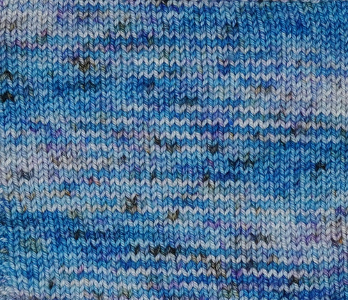 Wild Woollys Galaxy Voyage yarn with blue, purple, and white speckles