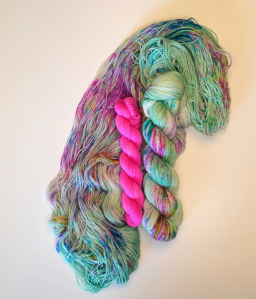 Undersea Garden - Fingering Sock Set by Wild Woollys. Three skeins of yarn, one bright pink, two variegated