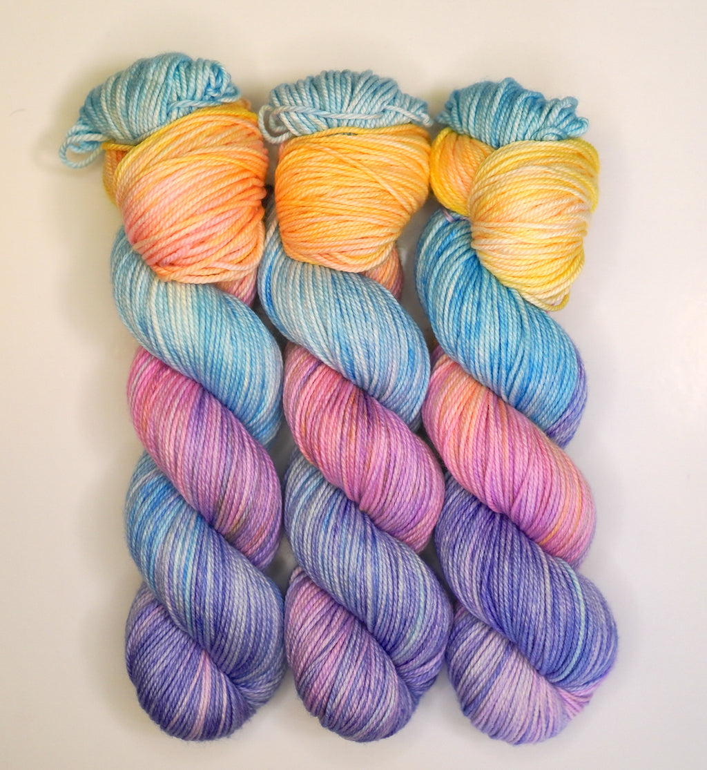 Wild Woollys Fantasy yarn in blue, orange, pink, and purple