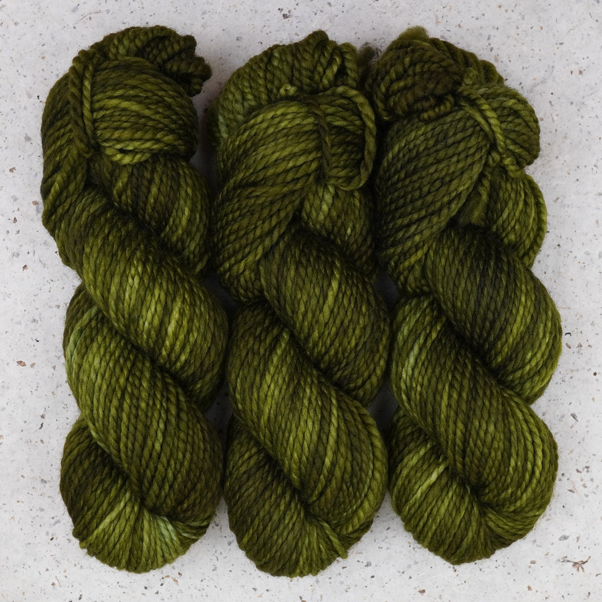 Wild Woollys Fiddlehead Fern Bulky yarn, three skeins in deep olive green