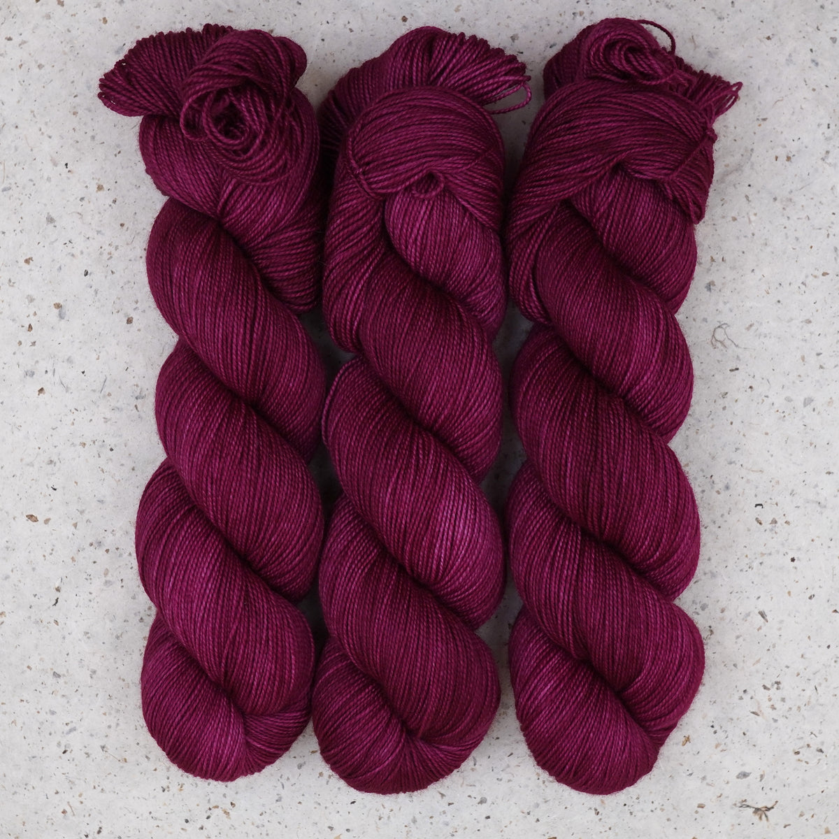 Wild Woollys Fuchsia Nostalgia Fingering yarn, three skeins in deep magenta and berry pink
