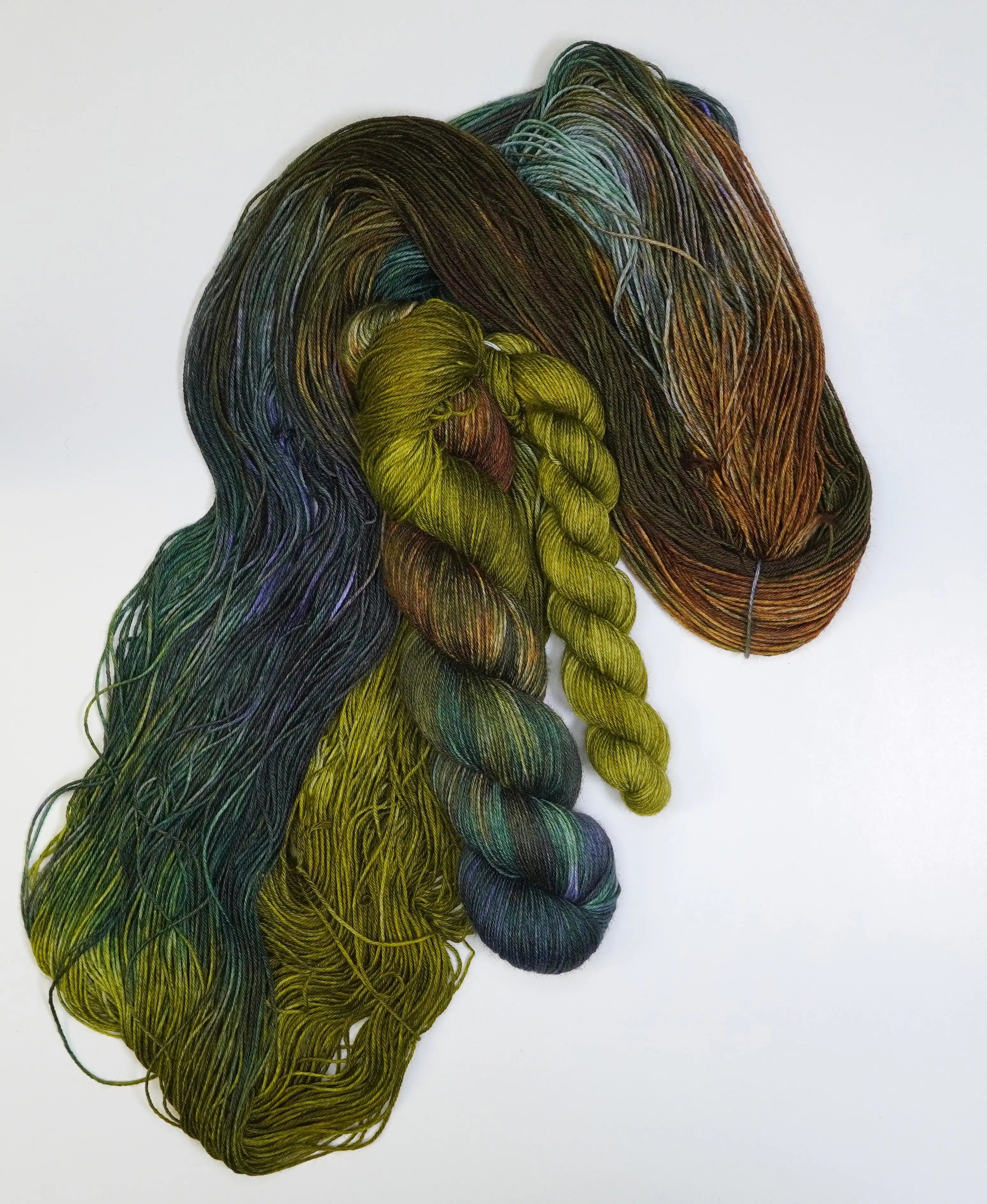 Wild Woollys Mycelium Bloom Fingering Sock Set, green, brown, and blue yarn