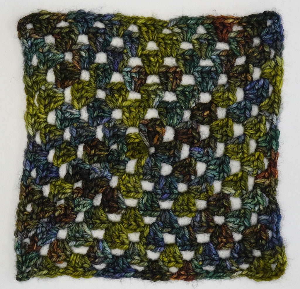 Wild Woollys Mycelium Bloom yarn crocheted into a granny square pattern