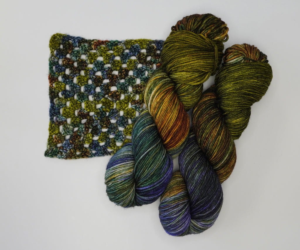 Wild Woollys Mycelium Bloom yarn with a crocheted swatch
