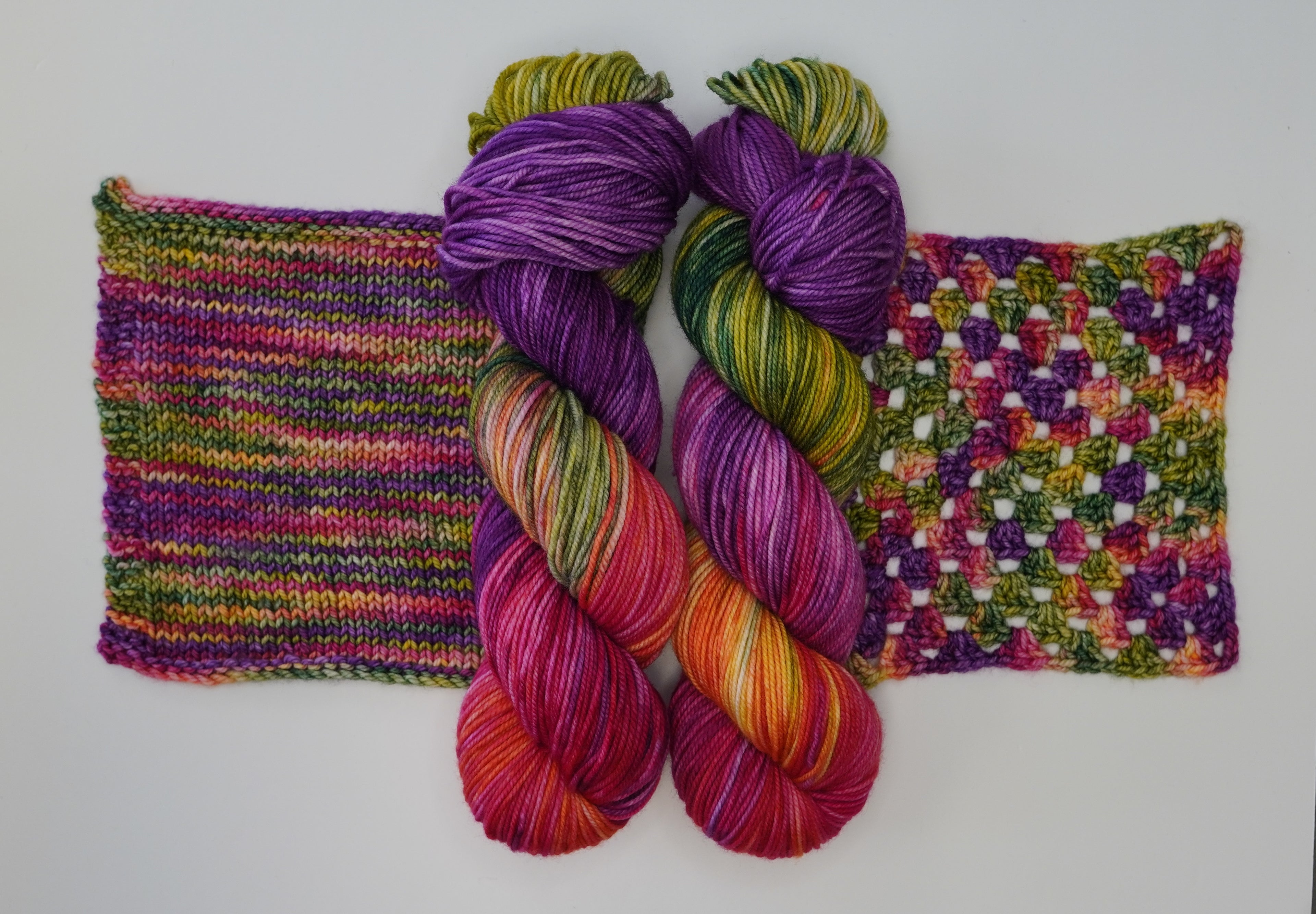 Wild Woollys Summer Berry yarn with knitted and crocheted swatches