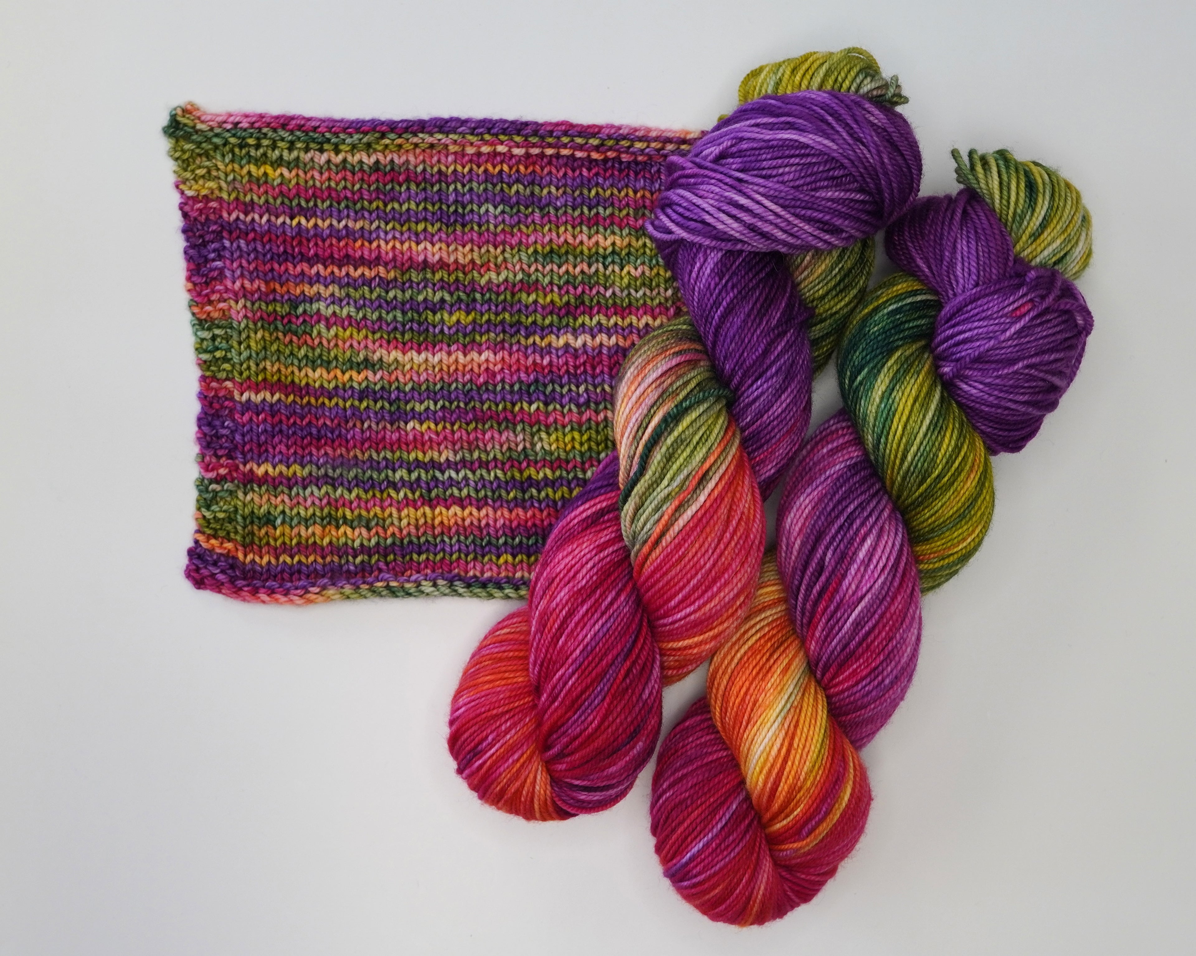 Wild Woollys Summer Berry yarn with knitted swatch