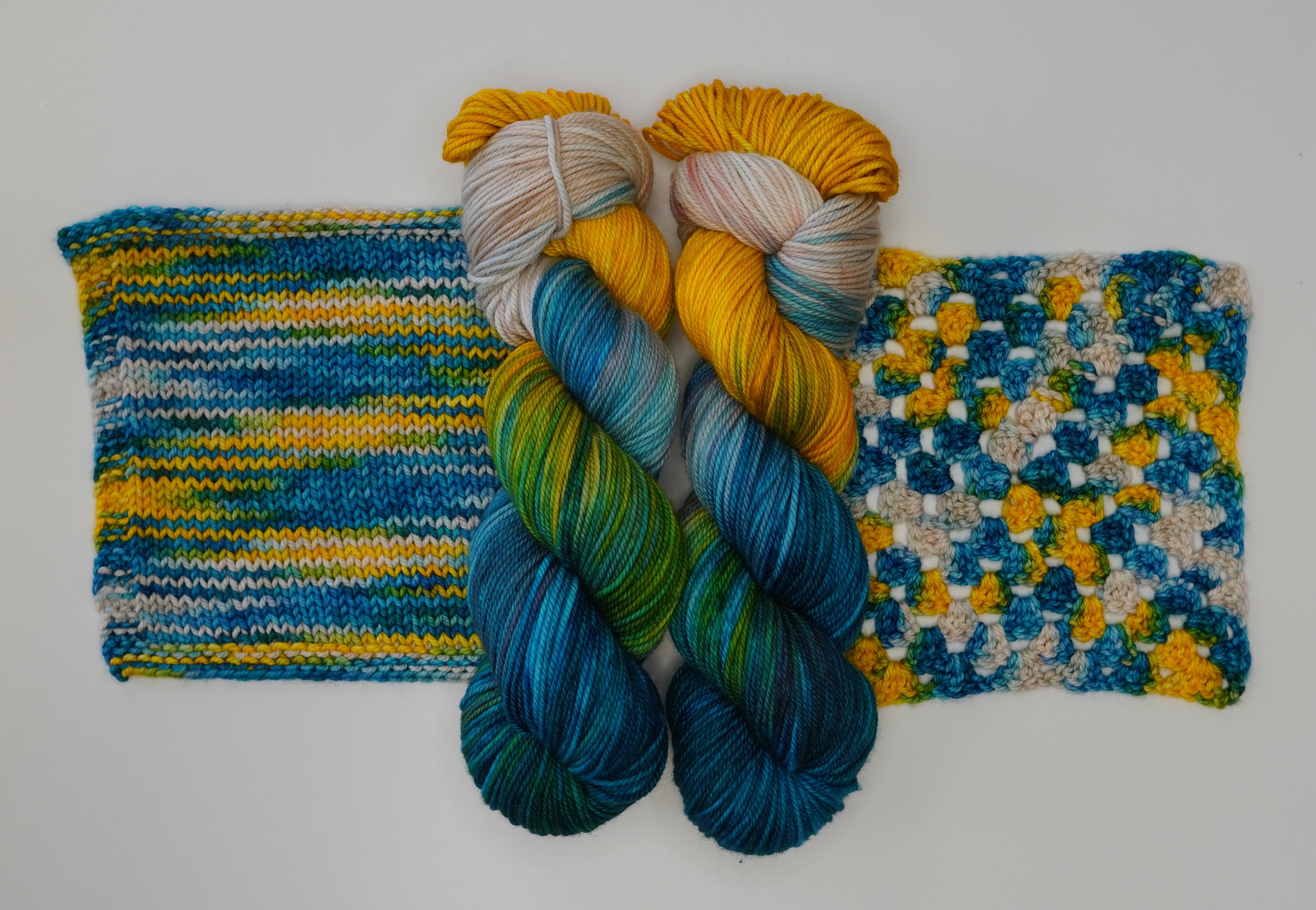 Wild Woollys Tropical Escape yarn with knitted and crocheted swatches
