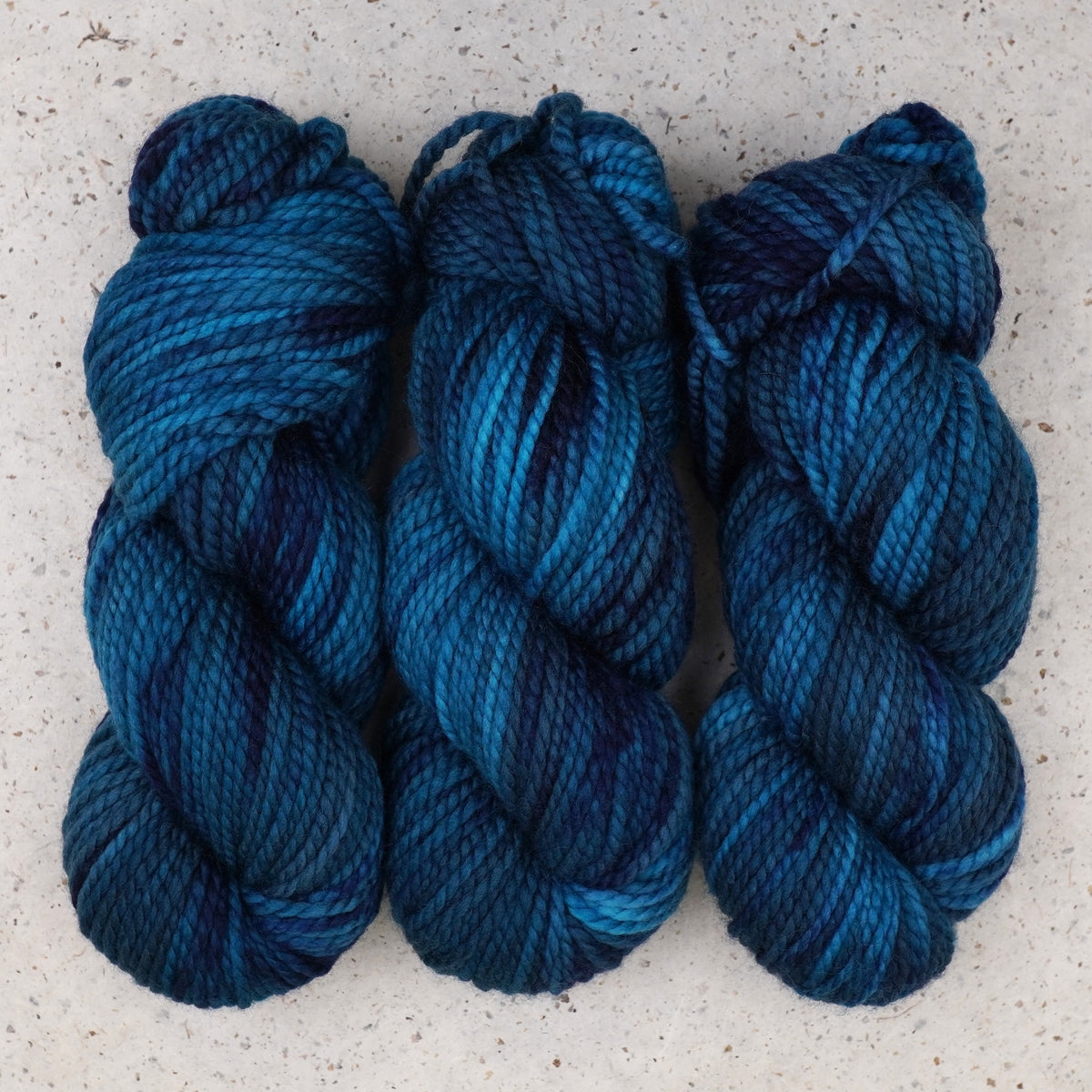 Wild Woollys Teal of Fortune Bulky yarn, three skeins in deep teal and blue
