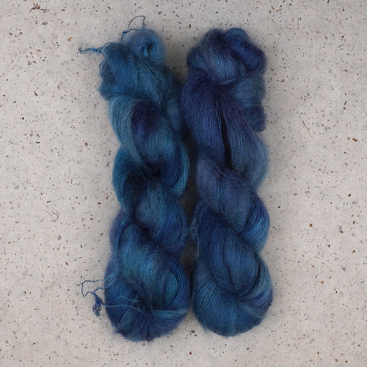 Wild Woollys Teal of Fortune Mohair and Silk yarn, two fluffy skeins in deep teal and blue