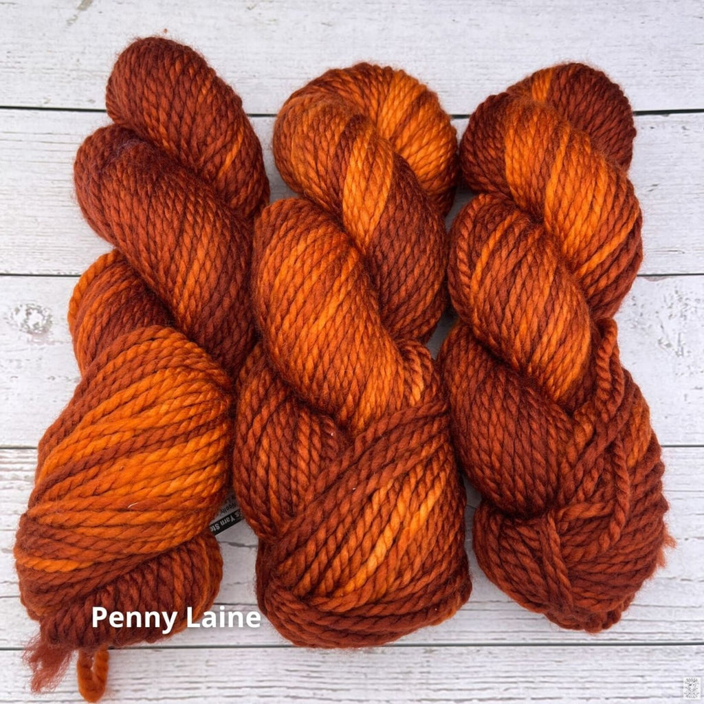 Wild Woollys Penny Laine Bulky yarn, three skeins in rich rust orange and copper