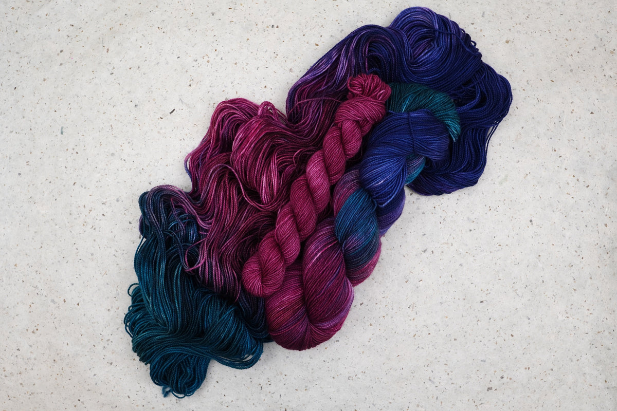 Winter Aurora Fingering Sock Set with coordinating pink mini skein